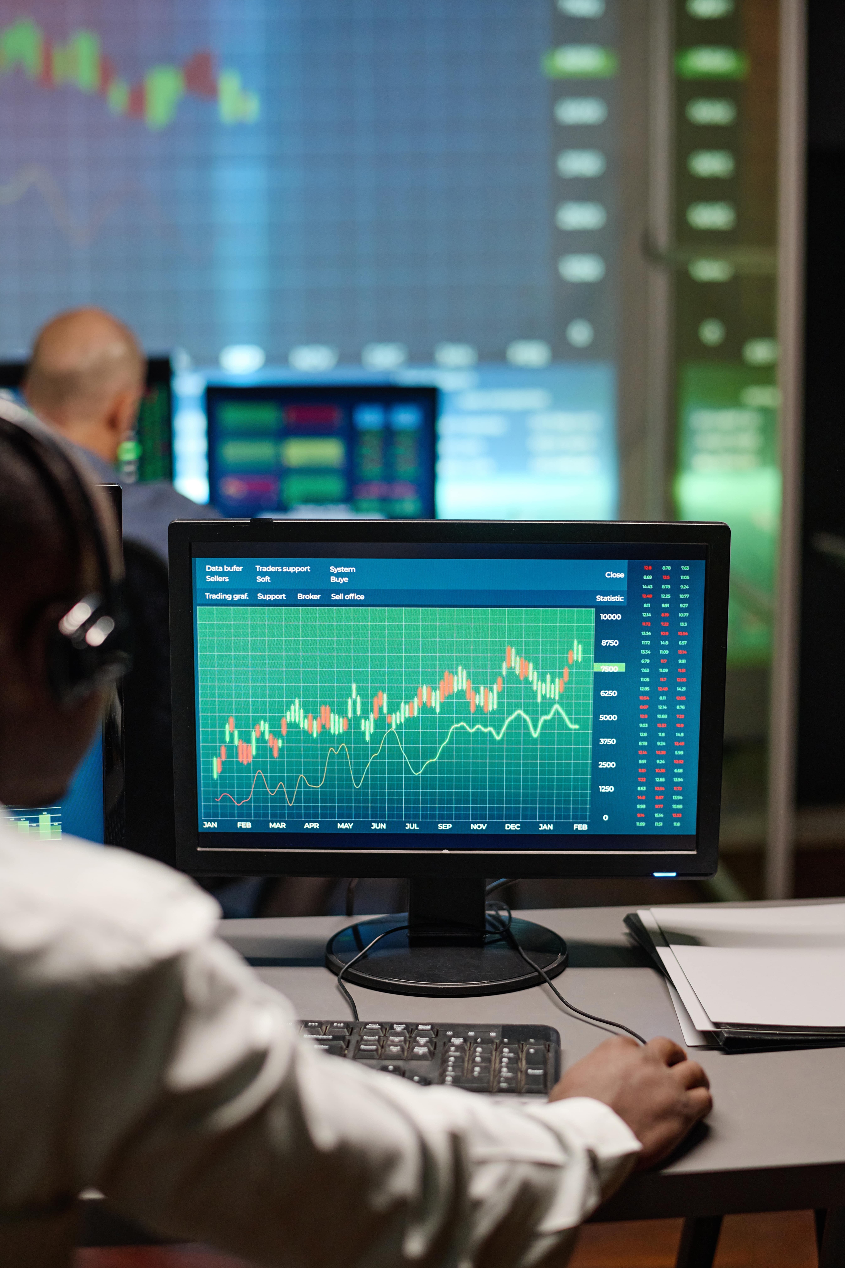 Energy trading professional working with market data and financial charts